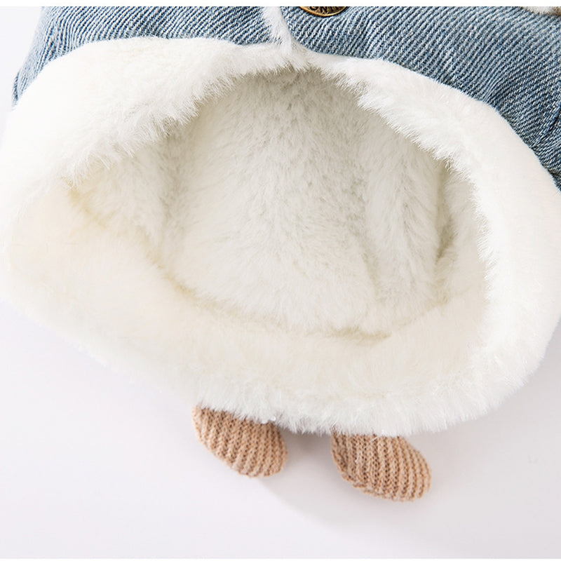 Blue denim pet vest back with white plush lining and knit tan paw accents