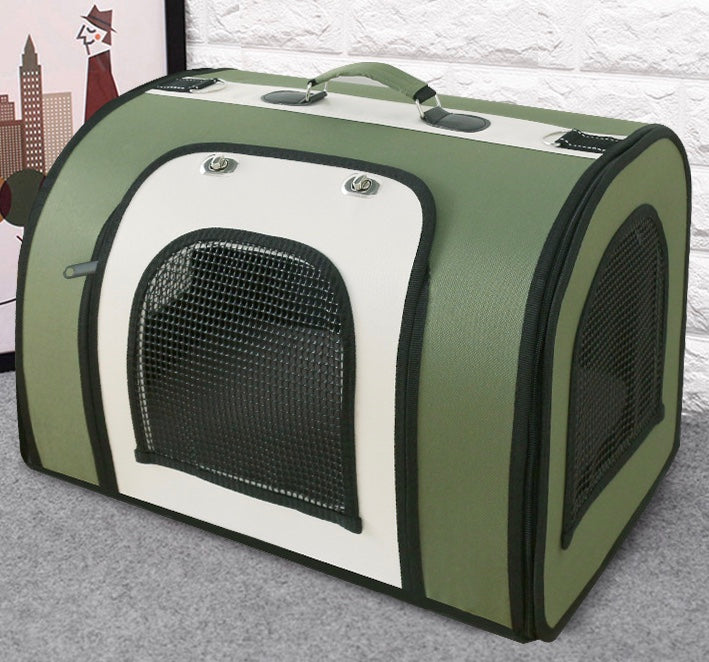 Green pet carrier handbag with front mesh window, side mesh panel, reinforced handles