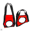 Red and black dog lifting sling with circular opening and padded single shoulder strap