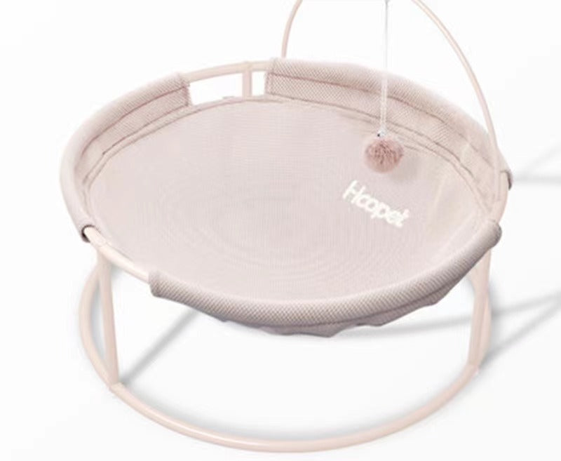 Round hanging pet bed with light beige/cream fabric cover and soft padded base