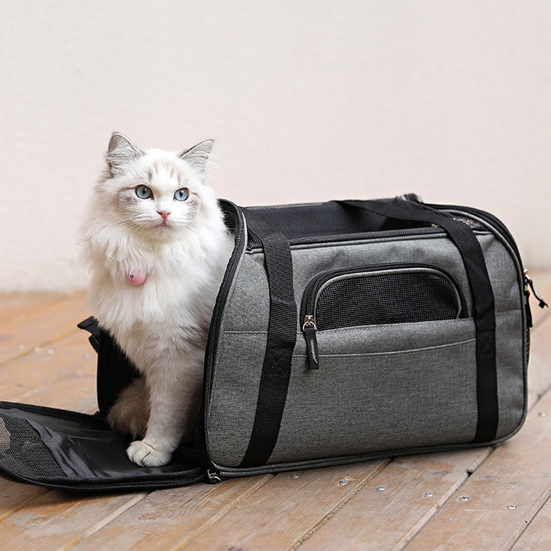 Grey soft pet carrier bag with mesh front panel pocket and shoulder strap, cat inside
