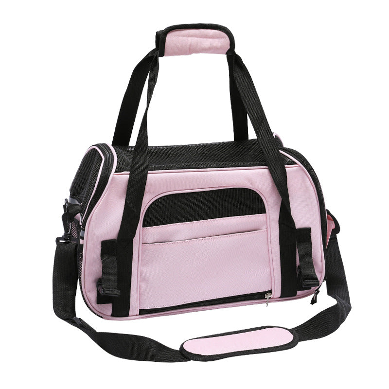 Pink soft pet carrier bag with mesh side panel and top handle, crossbody strap