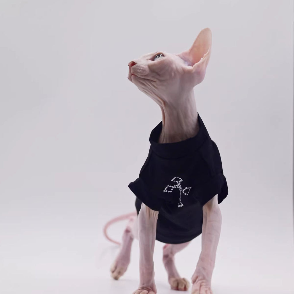 Black cat vest with cross rhinestone-style logo, round neck and short sleeves