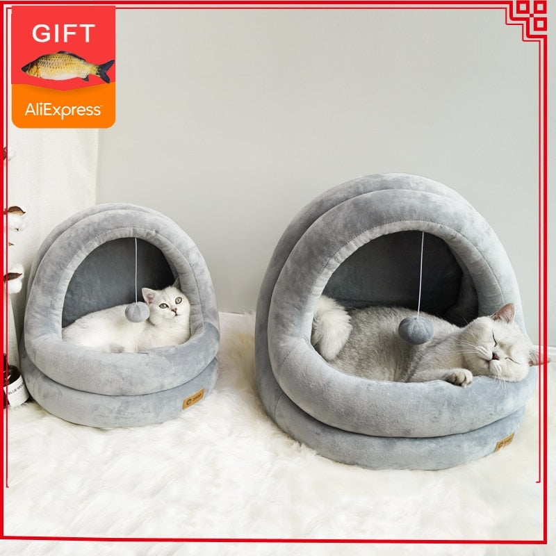 Gray cat cave bed with cushioned round bolster and soft interior pocket
