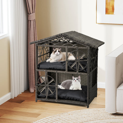 Two-story wicker cat house with removable dark gray cushions and arched door panels