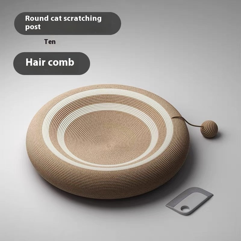 Round beige sisal cat scratch board with white spiral rings, small ball, and hair comb