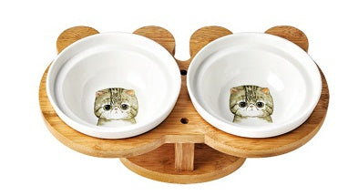 Ceramic cat bowl set with two white bowls featuring a tabby cat face design.