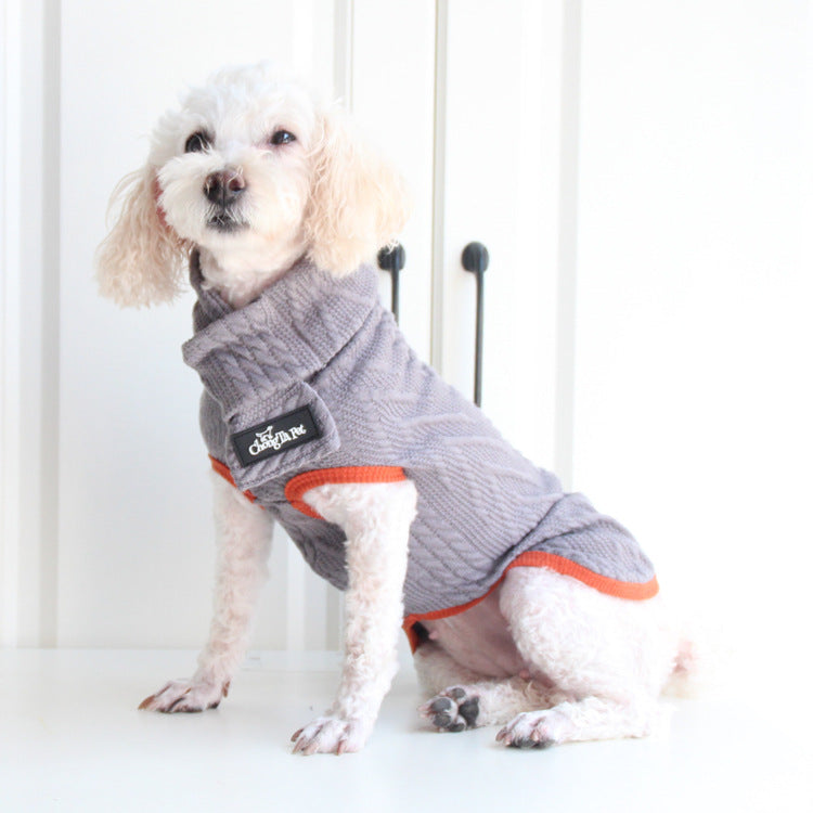 Grey cable-knit pet sweater with orange trim and small logo patch
