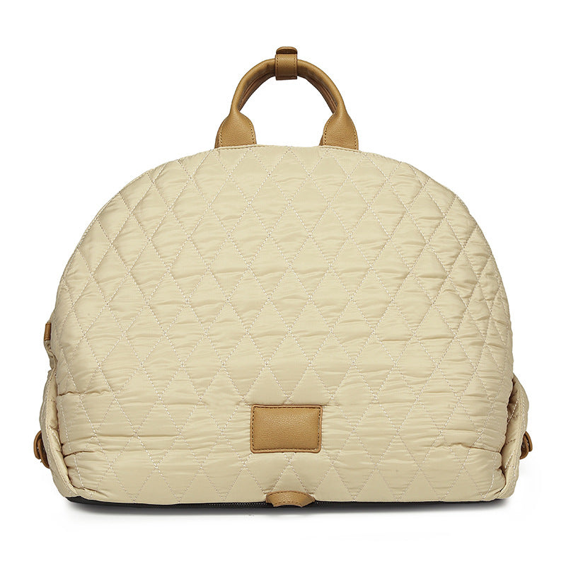Cream quilted pet handbag with top handle and tan front patch