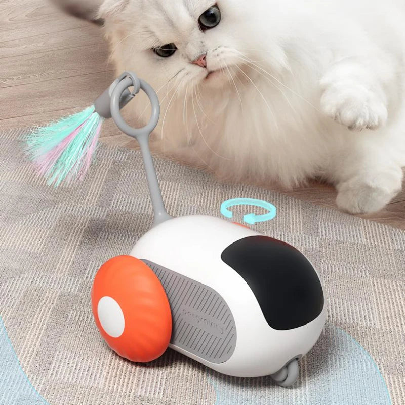 White automatic remote-control cat car toy with orange bumper and hanging rainbow brush