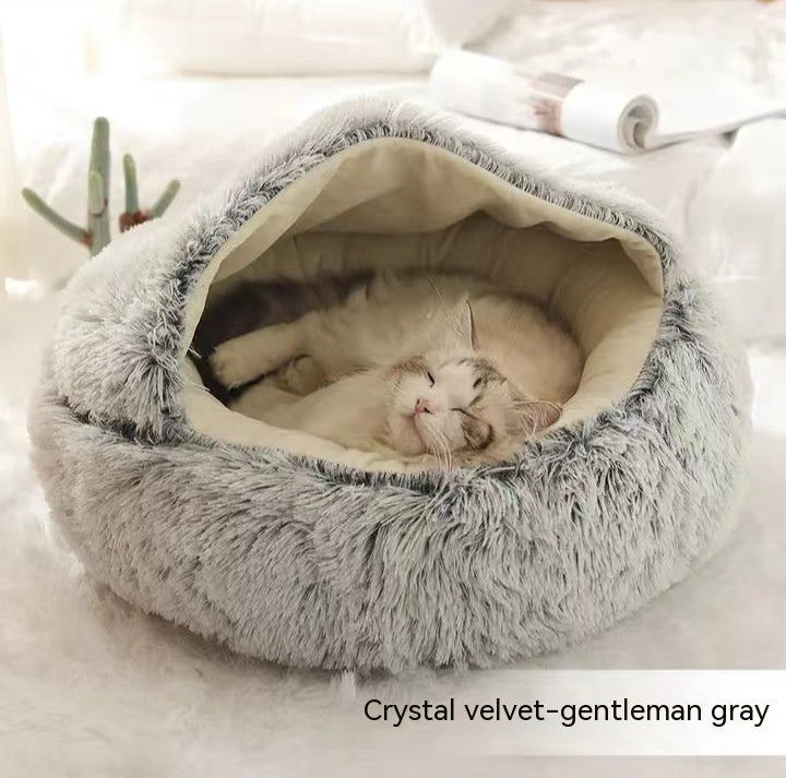 Round plush pet bed in light gray with deep cave opening and fuzzy hood