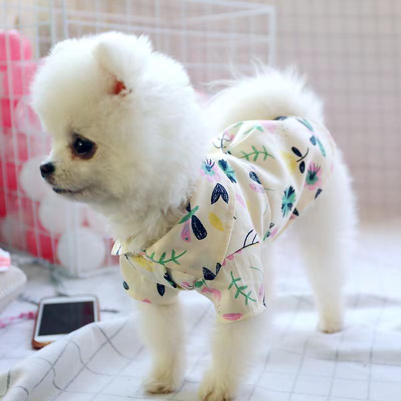 Small-dog pet pajamas, cream with colorful botanical print, dog wearing front view