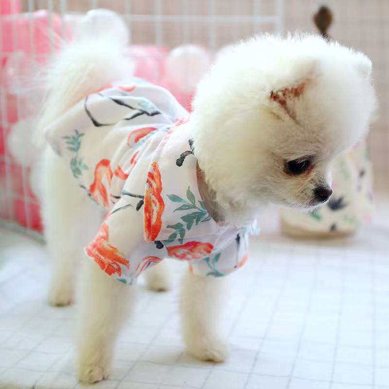 Small-dog pet pajamas, cream with colorful botanical print, dog wearing side view