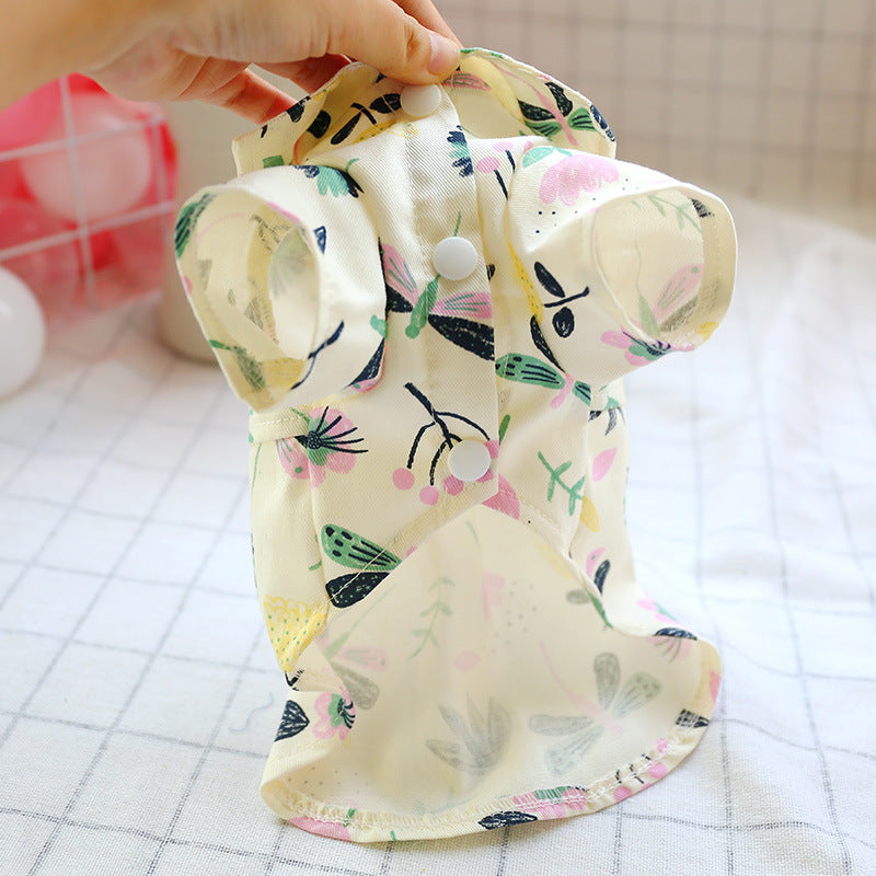 Pet pajamas for dogs, cream floral print with snaps, hand-holding close-up