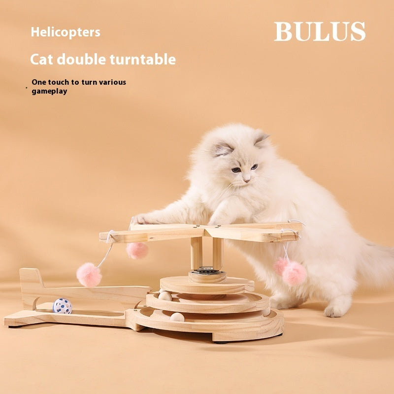 Wood cat turntable scratch toy with hanging pom-poms and rotating ball track, with cat