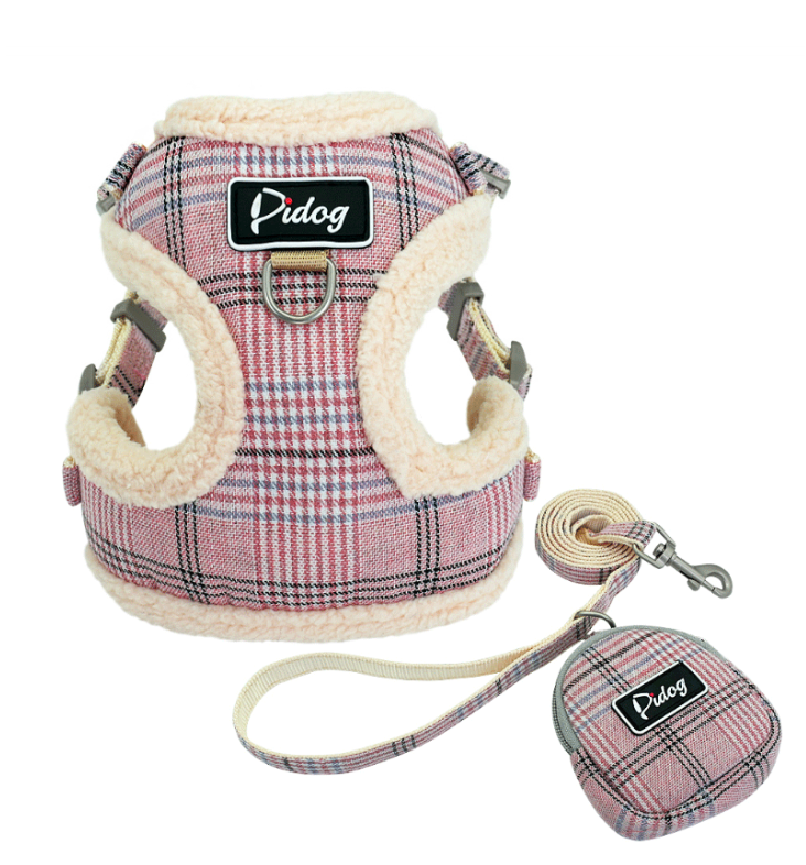 Plaid plush dog harness with matching leash and round pouch accessory, red/blue tones.