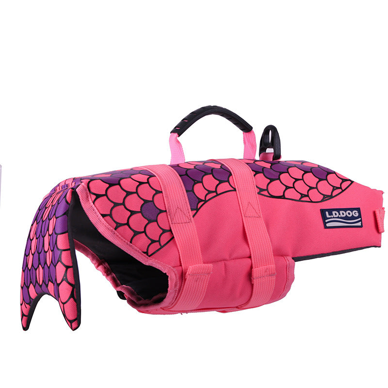 Pink mermaid-scale dog life jacket with black inner flap and adjustable straps