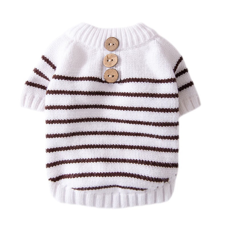 White dog knit sweater with brown-striped bands and three wood buttons at neck