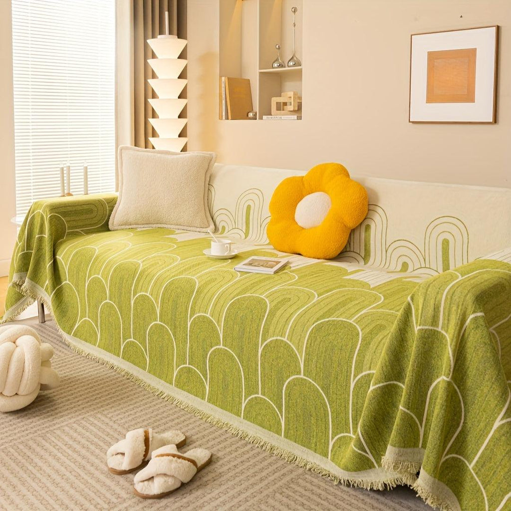 Pet sofa cover in light green with white arch-line pattern and fringed edge