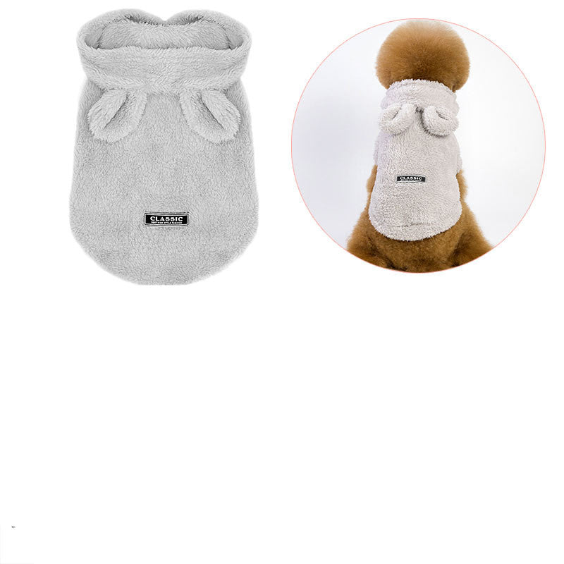 Grey plush cat outfit pouch with gathered hood and bow; small logo patch on front