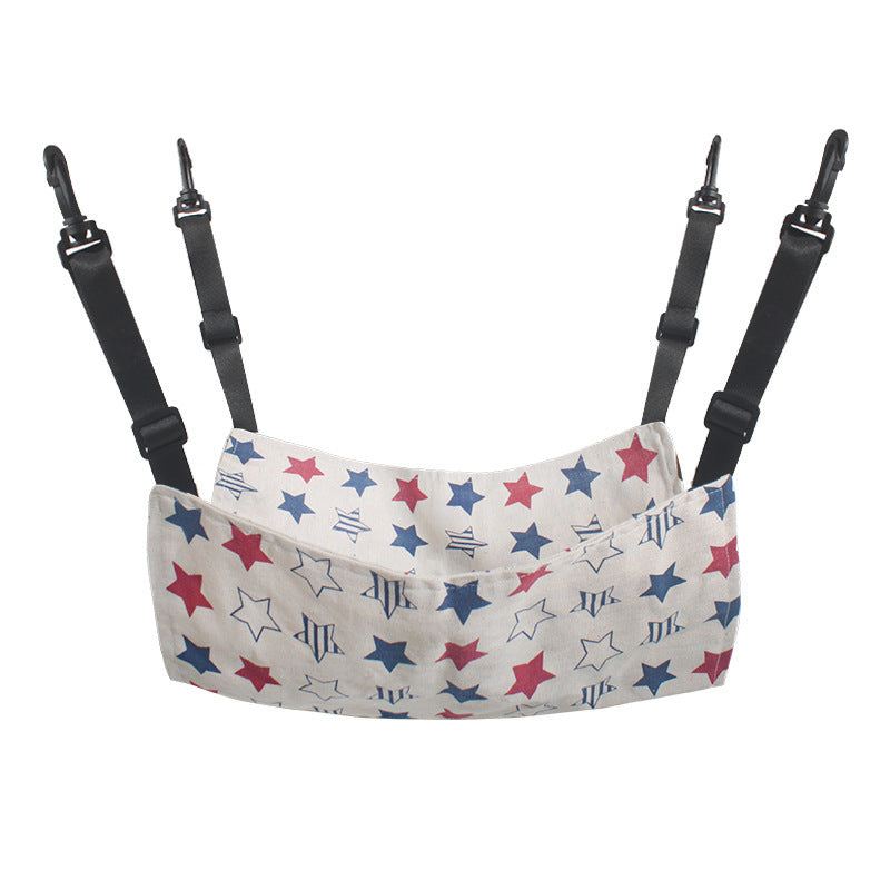 Hanging cat hammock bed with star print, white fabric and red/blue accents