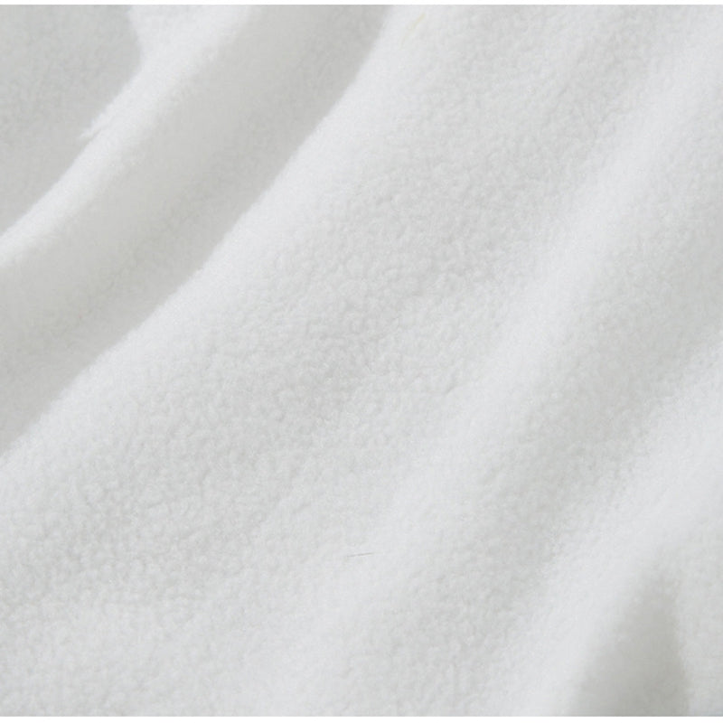 Light cream plush fabric swatch with textured surface