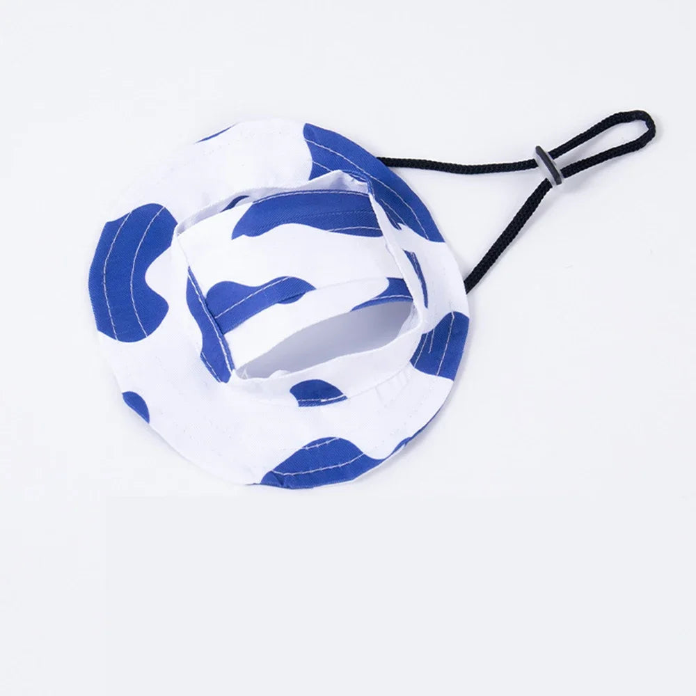 Adjustable pet bucket sun hat in white and blue camo with chin strap and ear-hole openings