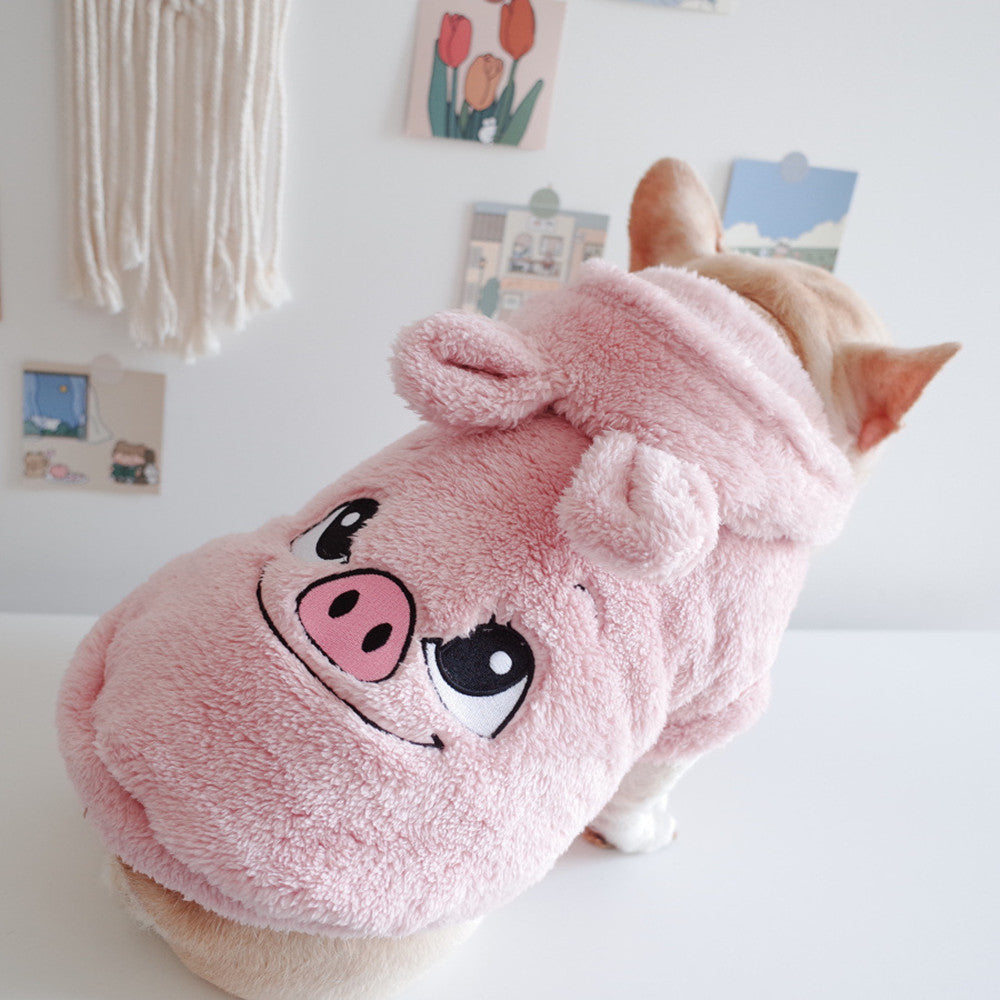Pink plush pet hooded vest with cartoon dog face patch, soft fuzzy texture