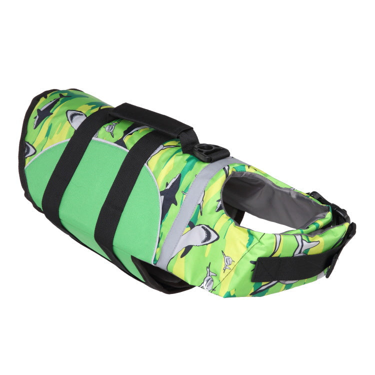 Green, black, and white dog life vest with shark-face print and black harness straps