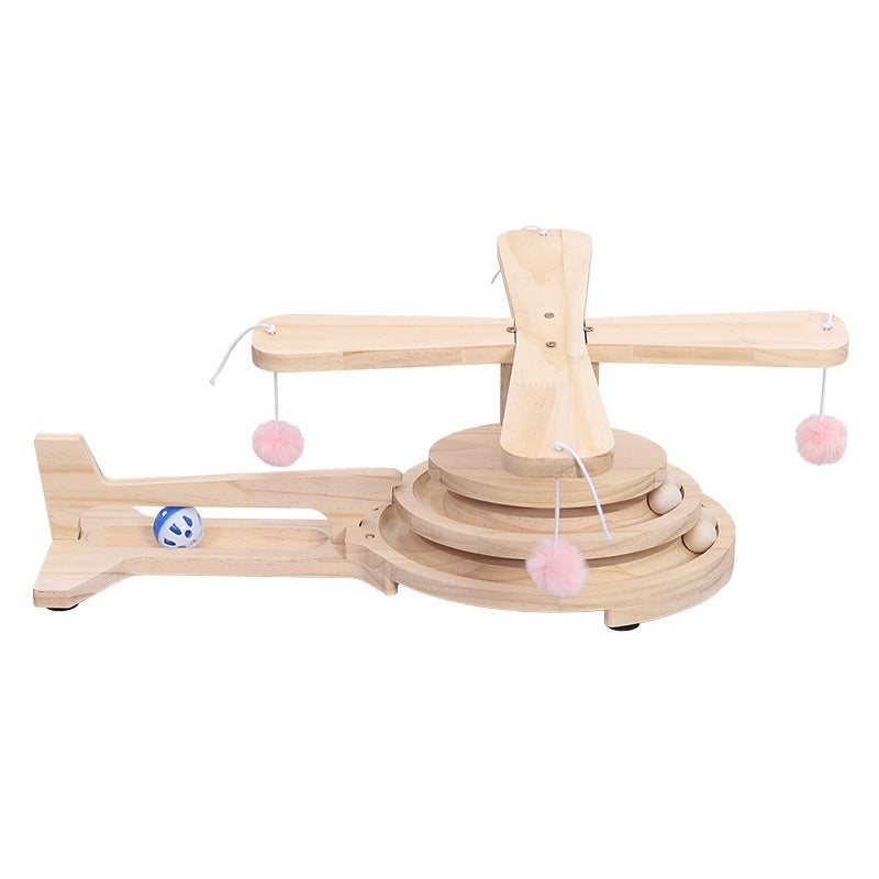 Wood cat turntable scratch toy with rotating track, hanging pom balls, and blue ball