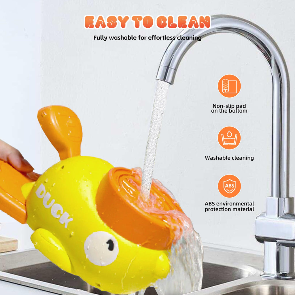 Yellow duck-shaped treat dispenser toy with orange dome and clear body, rinsed with water.