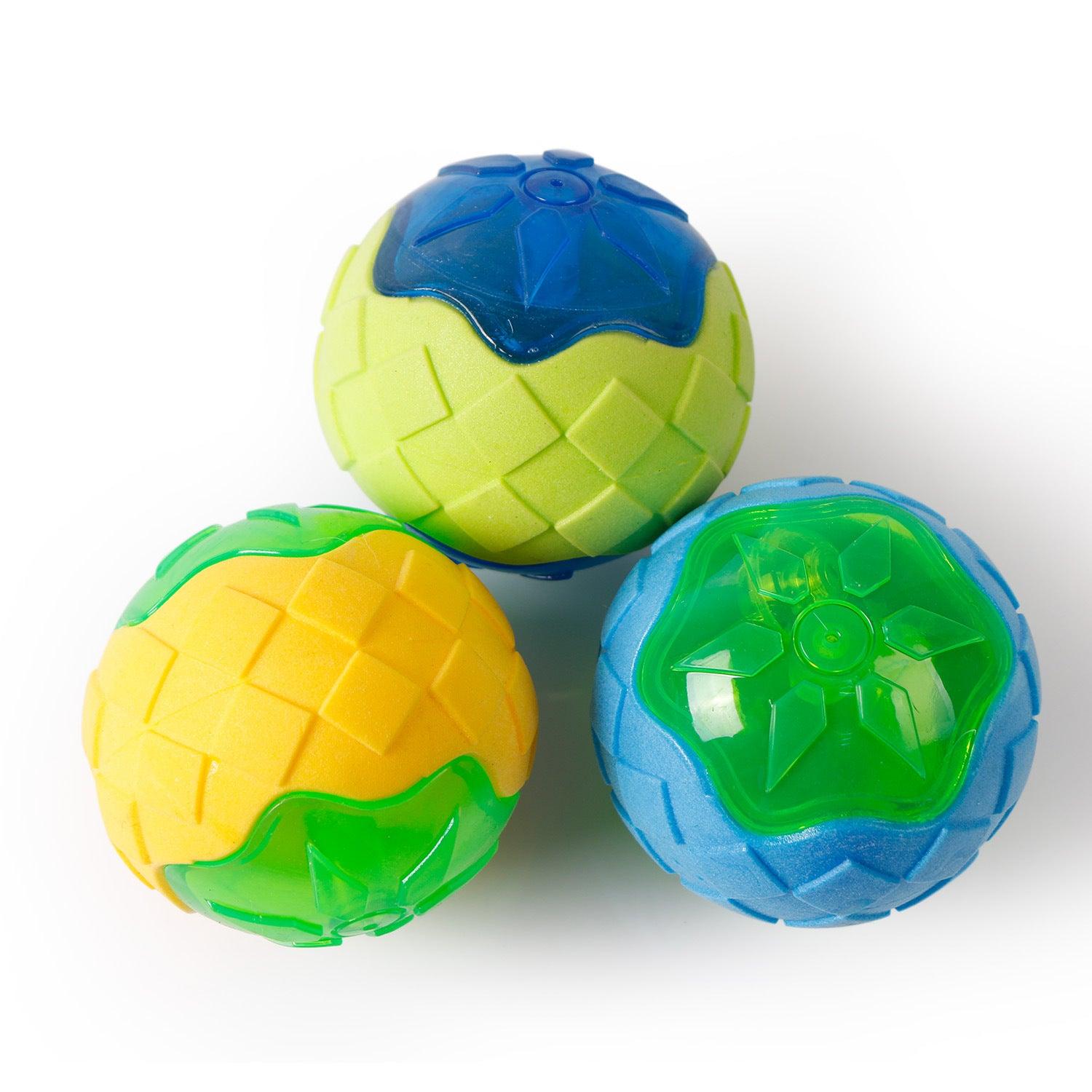Set of glowing audible textured dog toy balls in blue, yellow, and green
