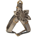Pet flannel harness with gold hardware, flower centerpiece, and adjustable straps