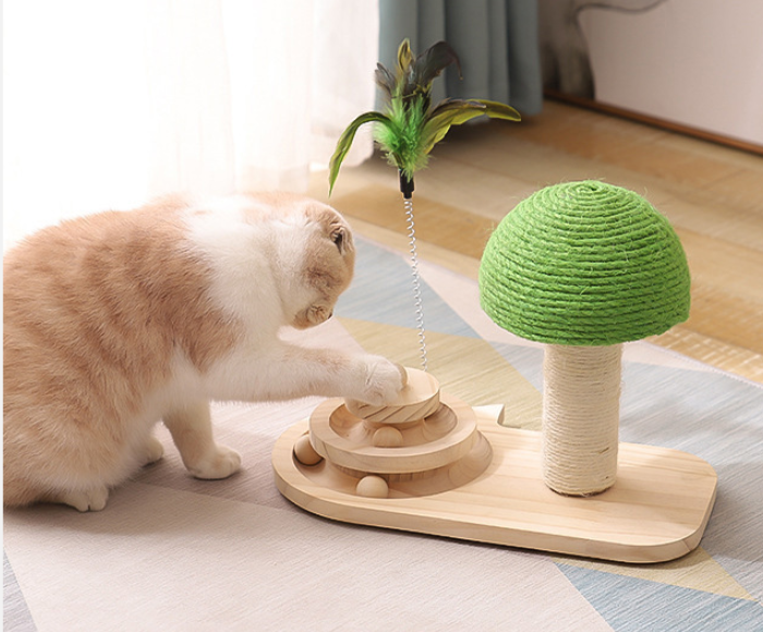 Green sisal cat scratch post with round toy ball, feather wand, and wooden base