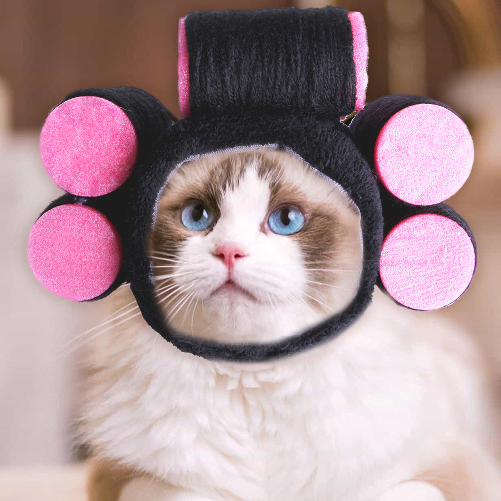 Black pet hat with pink pom-poms and a tall center panel, blue inner lining
