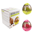 Green and pink pet treat dispenser balls with clear windows