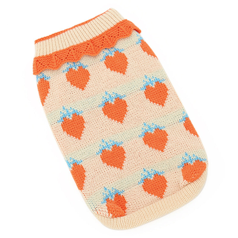 Cat sweater flat lay: cream knit with orange collar and blue-and-orange heart motifs
