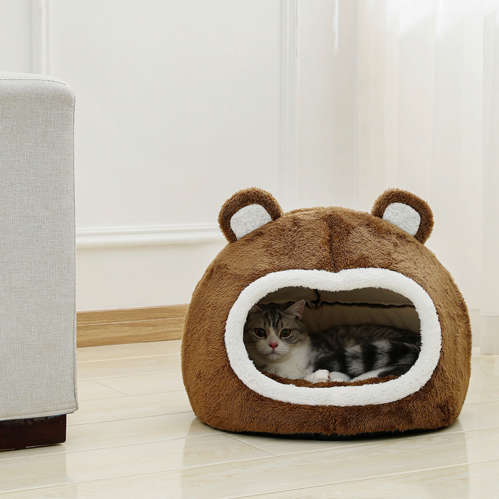 Bear-shaped cat bed house in brown plush with white oval doorway opening