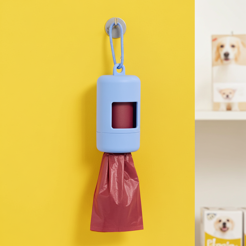 Cornflower blue waste bag dispenser with latch and hanging red bag