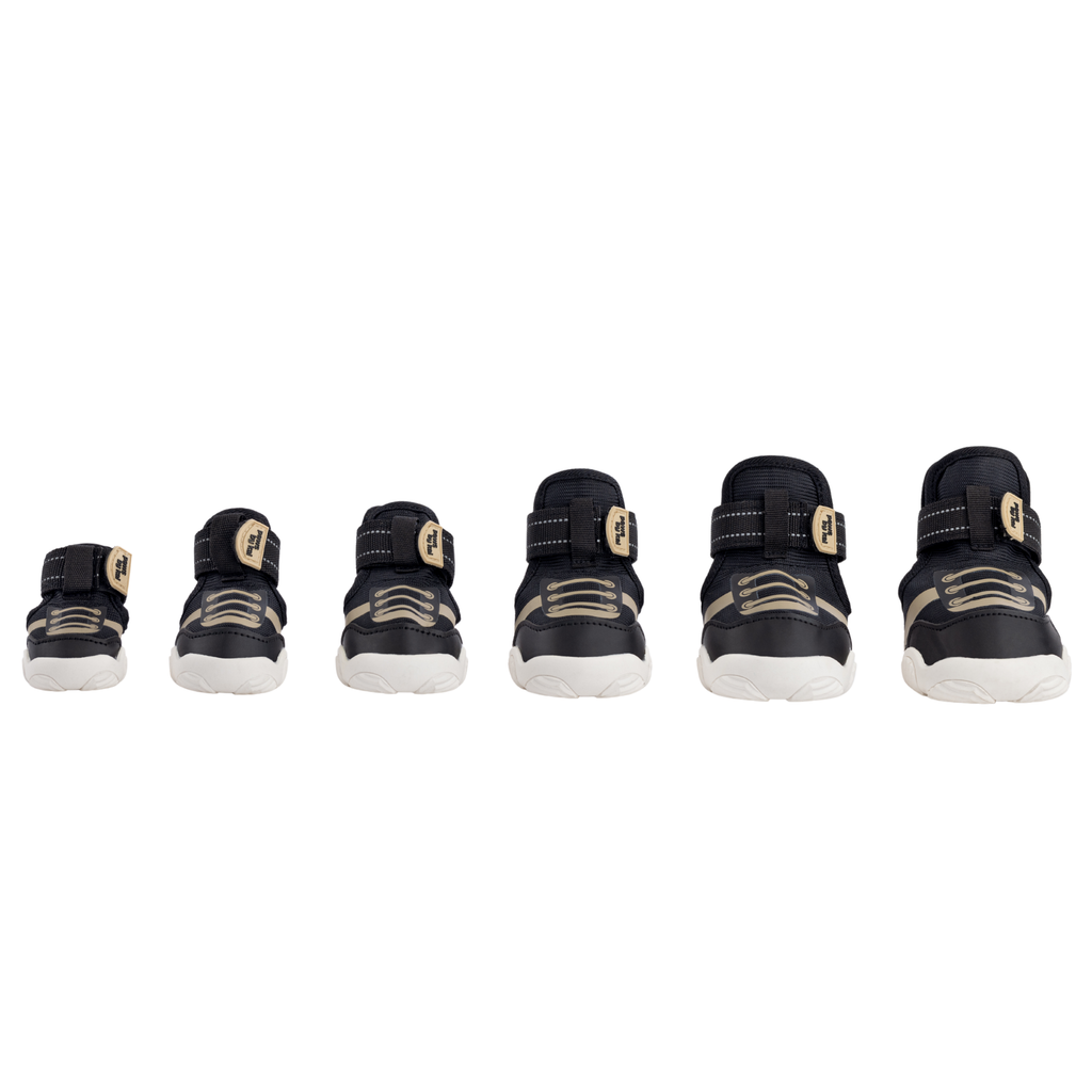 Kai- Dog sneakers in black displayed in multiple angles with Velcro straps
