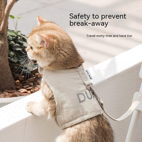 Beige cat chest harness with adjustable strap and metal leash clip on cat