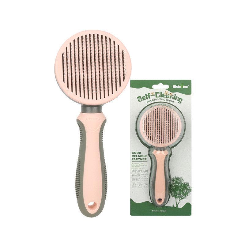 Pink automatic pet hair removal comb with round needle brush head and textured handle