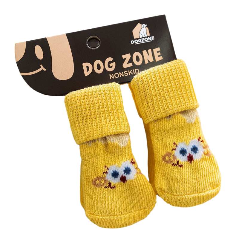 Pair of knit dog socks, yellow with blue-eyed bear face patches and ribbed cuffs.