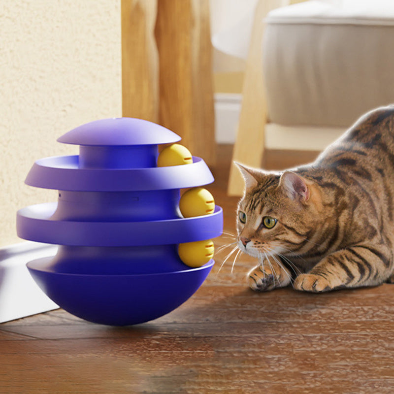 Blue 3-layer cat turntable tower toy near a tabby cat on a wooden floor
