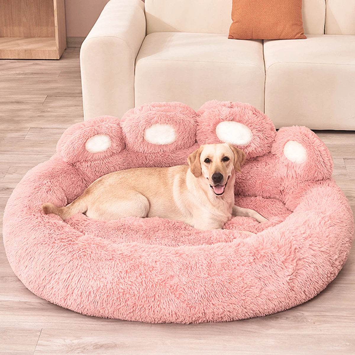 Pink plush pet sofa bed with paw-print bolsters and cozy inner cushion