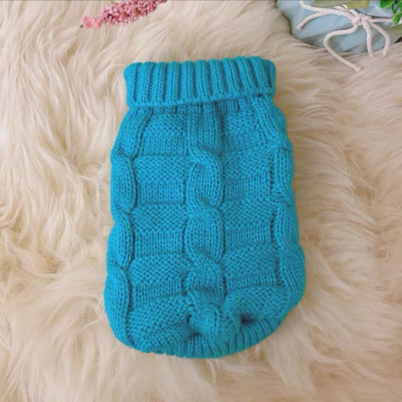 Knitted cat sweater in blue with ribbed turtleneck and textured oval panel pattern