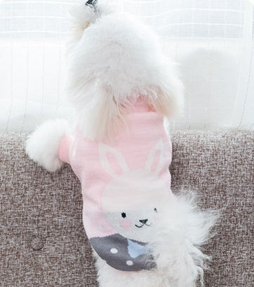 White knit pet sweater with pink sleeves and cat graphic
