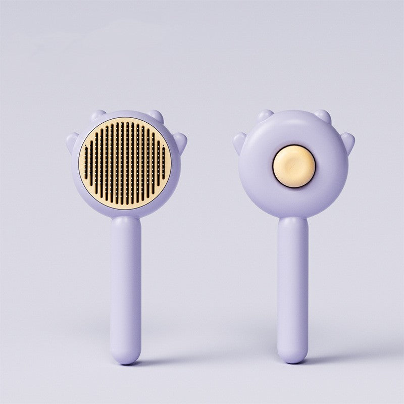 Pet grooming brush set with purple paw-shaped handle and beige bristle oval head