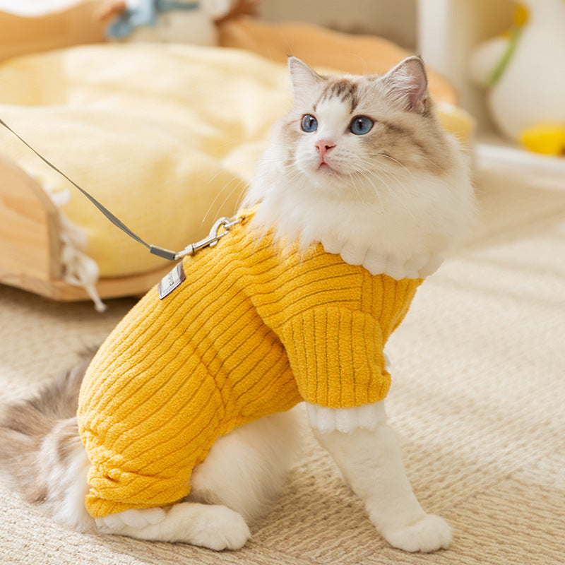 Cat wearing a yellow ribbed fleece pet jumpsuit with white ruffle collar