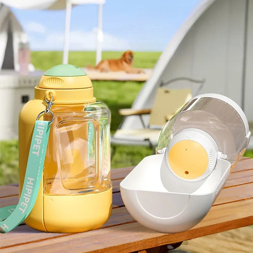 Yellow portable pet water bottle and integrated bowl with drinking spout